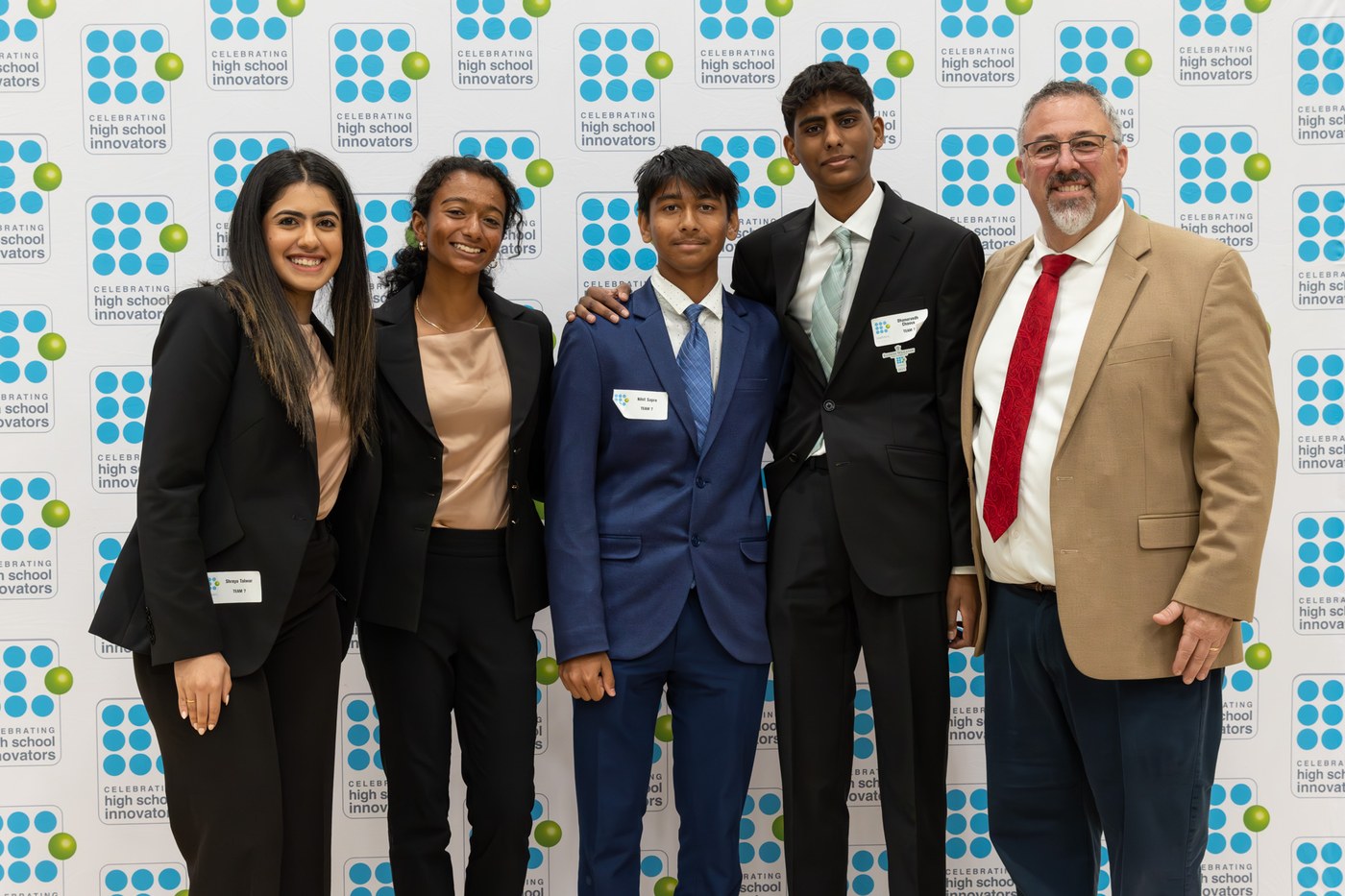 Simply Gifted team at Illinois Wesleyan InnoVators pitch competition with judges