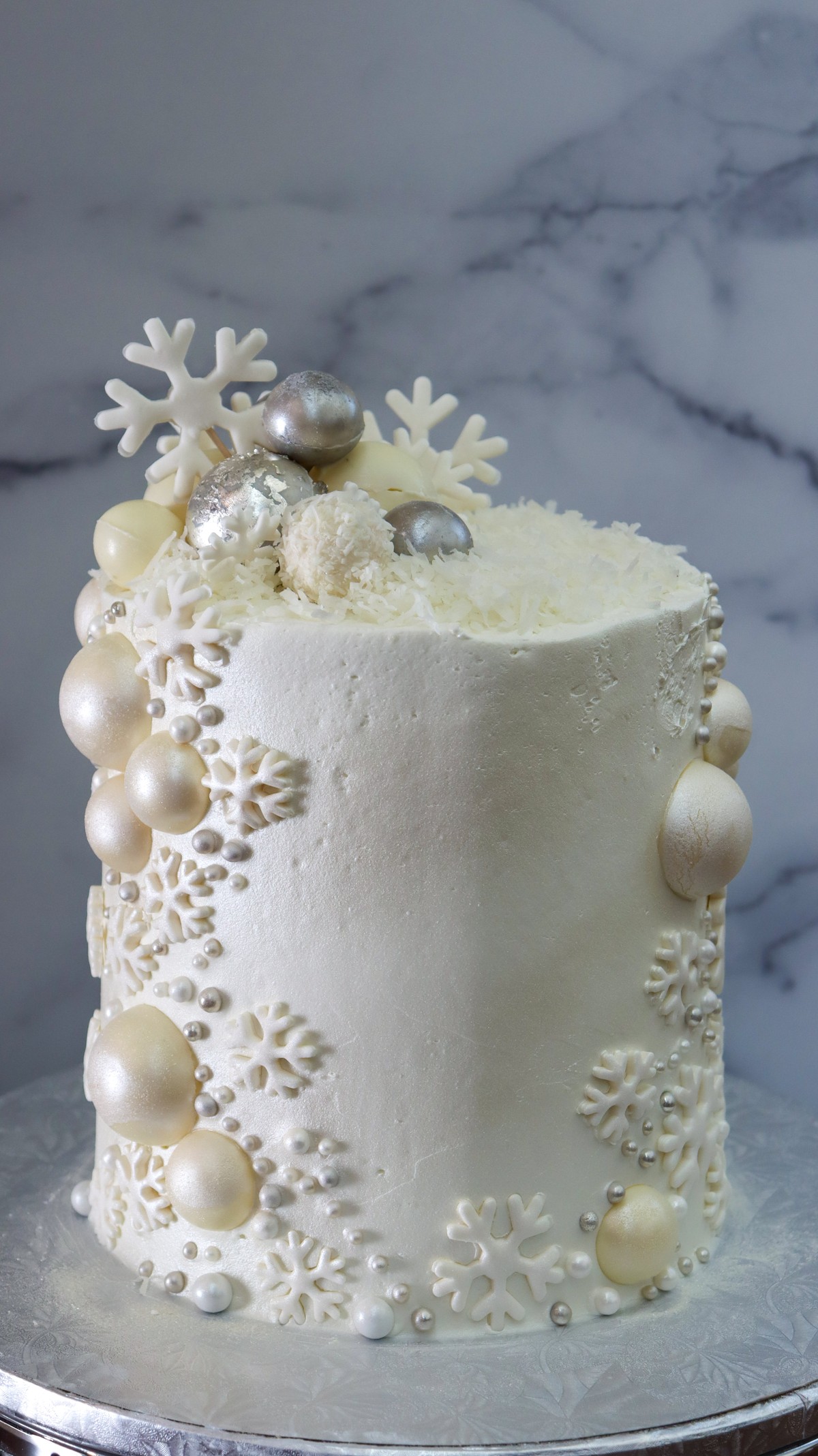 So Sweet Dessert Emporium — winter celebration cake with snowflake and pearl decorations